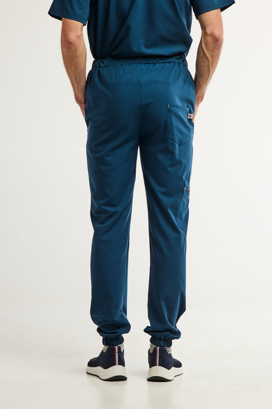 Pantalon médical bleu turquoise slim fit pour homme, alliant confort et style