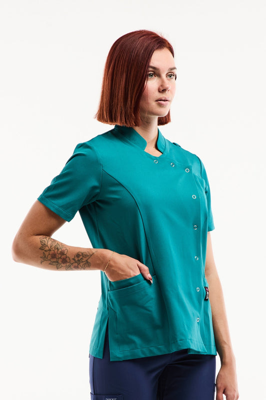 Blouse médicale Aurelia femme en bleu turquoise avec panneau contrasté et poche
