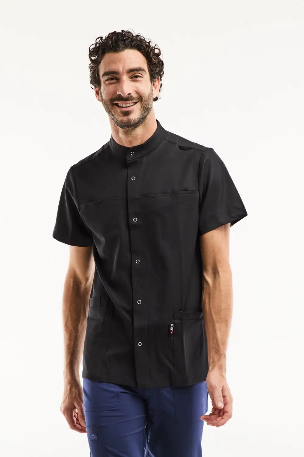 Blouse médicale homme noire à col officier moderne, tissu technique stretch