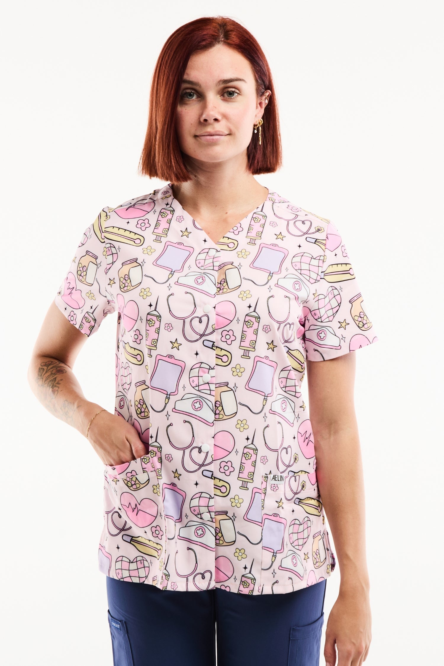 Tunique médicale stretch femme imprimée icônes infirmières rose or