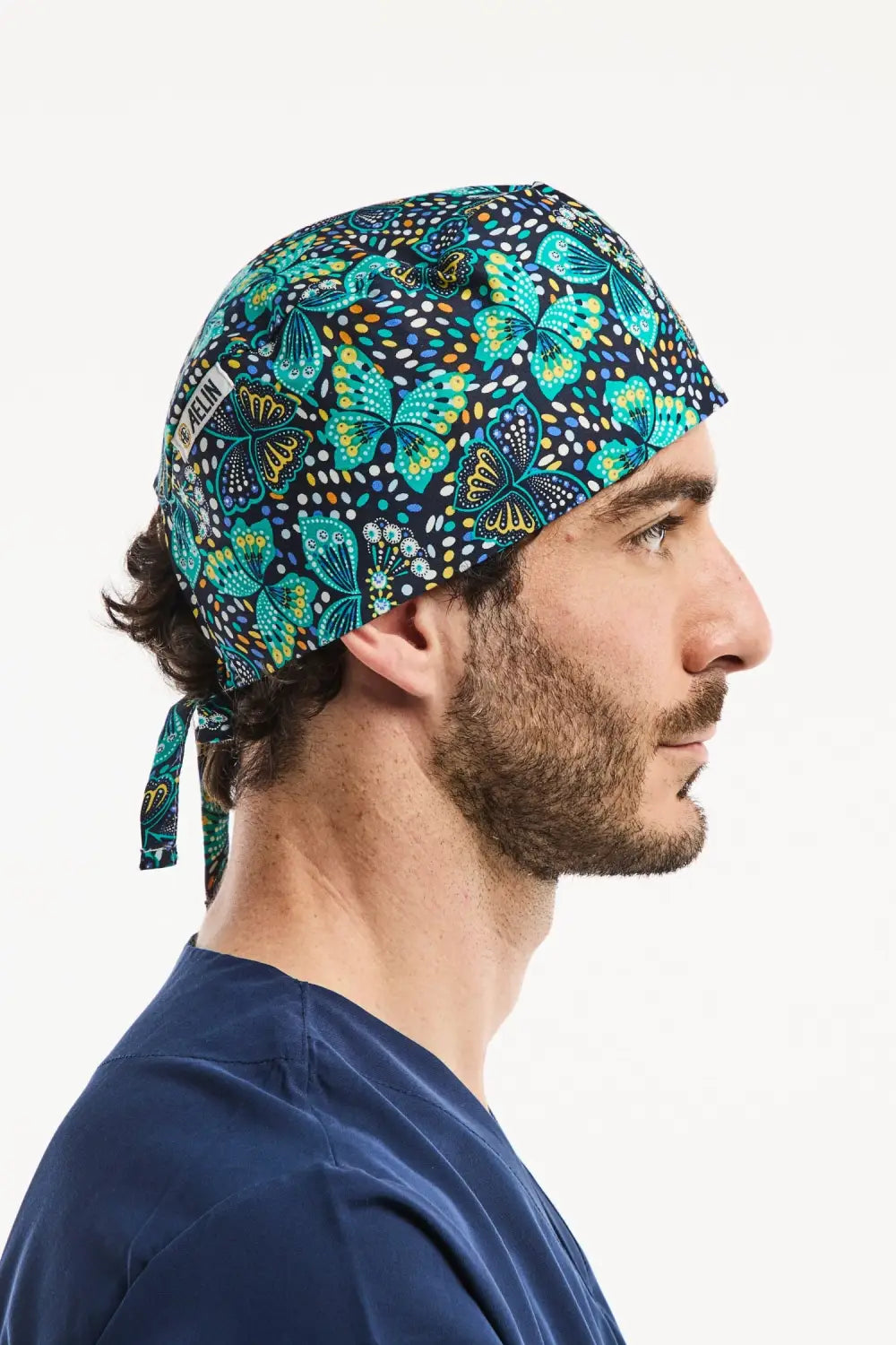 Calot médical Aelin bleu marine avec motif papillons pour professionnels de santé