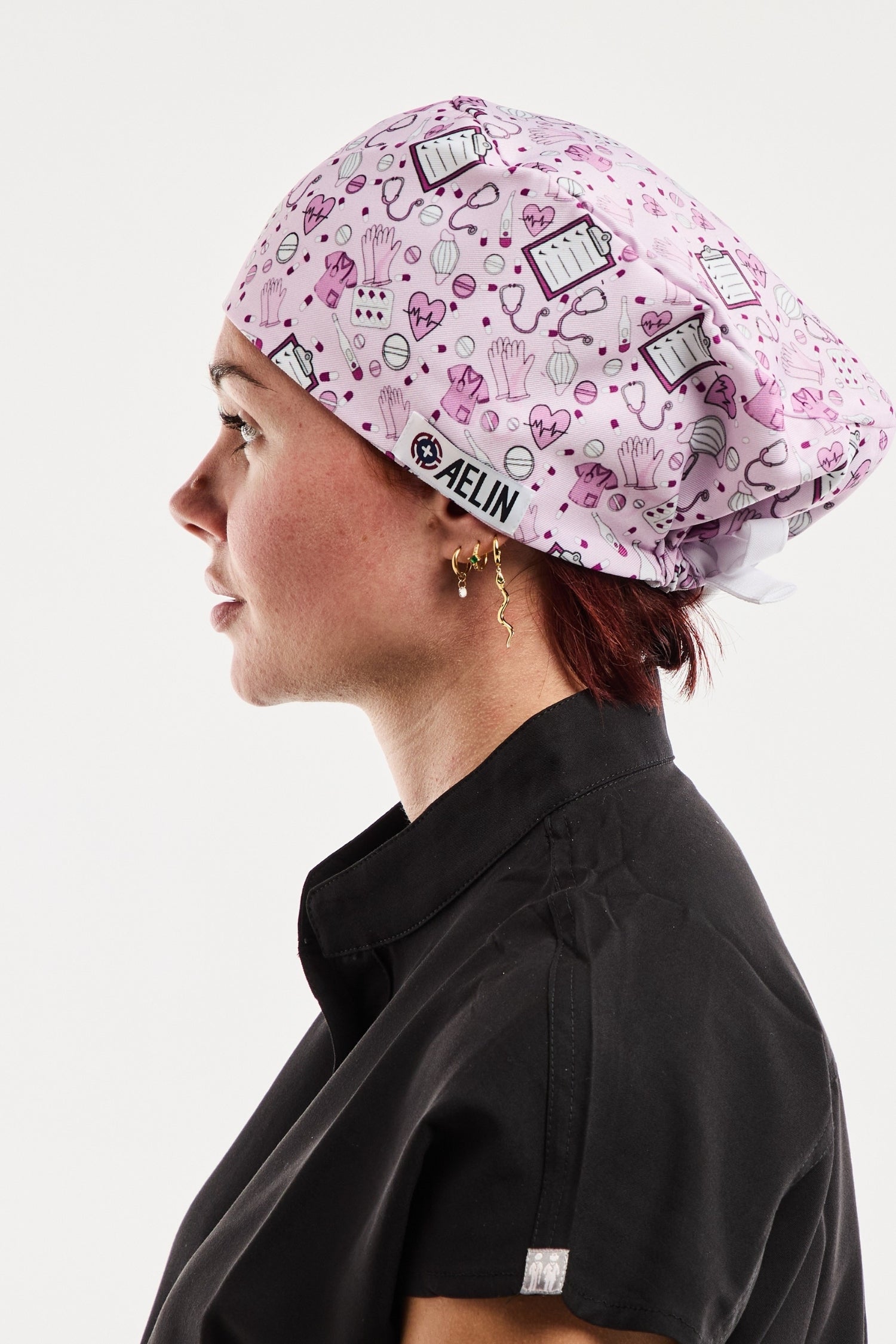 Calot médical rose Melin avec motif livre art