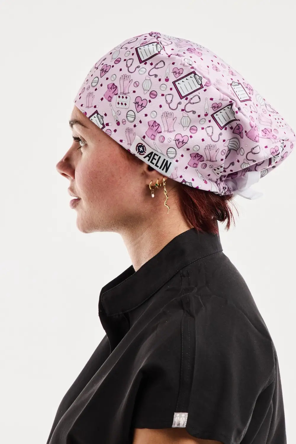 Calot médical rose Melin avec motif livre art