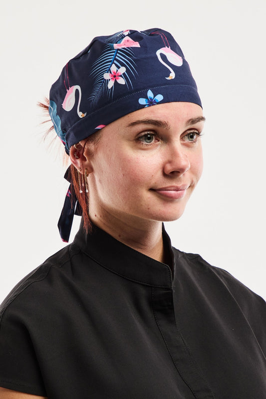 Calot médical imprimé flamants roses marine avec motifs floraux