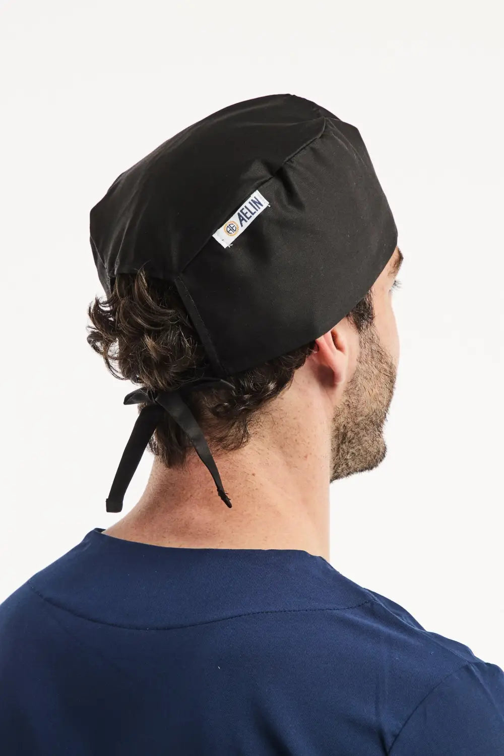 Calot médical noir pour cheveux courts, modèle conçu par Médical Aelin