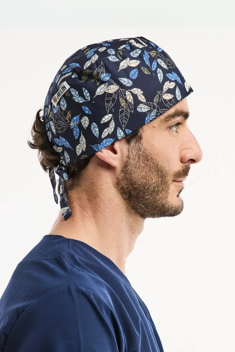Bonnet chirurgical bleu foncé pack découverte The dentist I, motif feuilles bleues claires