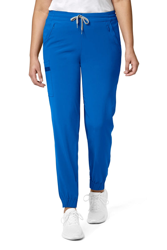 Femme en pantalon médical bleu royal coupe moderne avec poches classiques et poches cargo