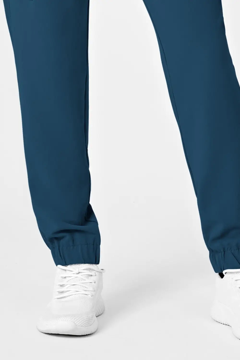 Pantalon médical femme bleu turquoise, coupe moderne avec poches classiques et cargo
